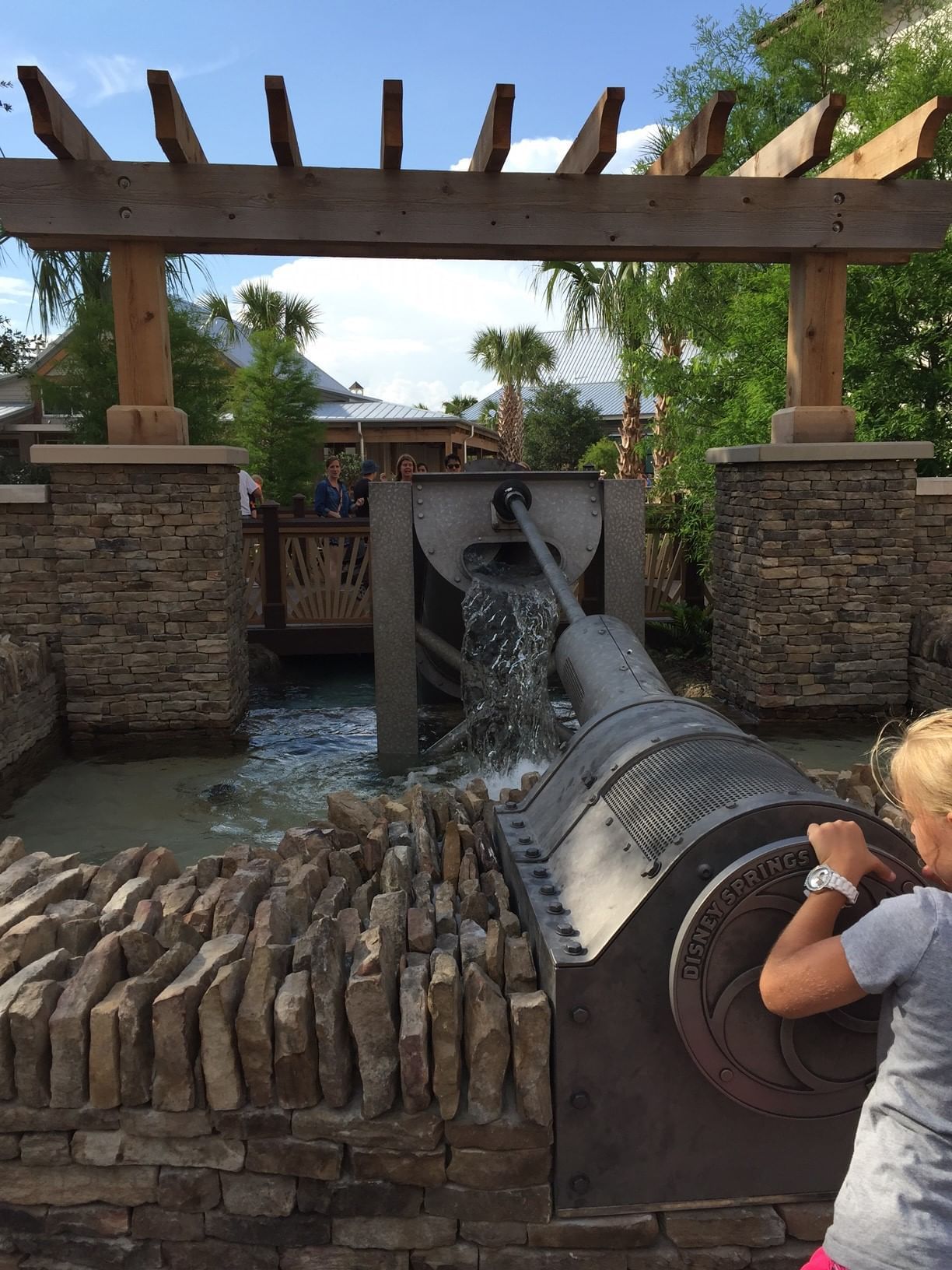 Water flowing from a large pipe into a canal near Lake Buena Vista Resort Village & Spa