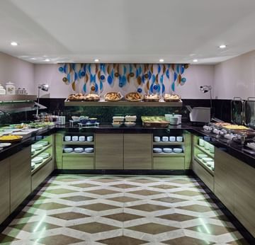 Breakfast Buffet set up with various dishes in the breakfast Restaurant at Titanic Comfort Mitte