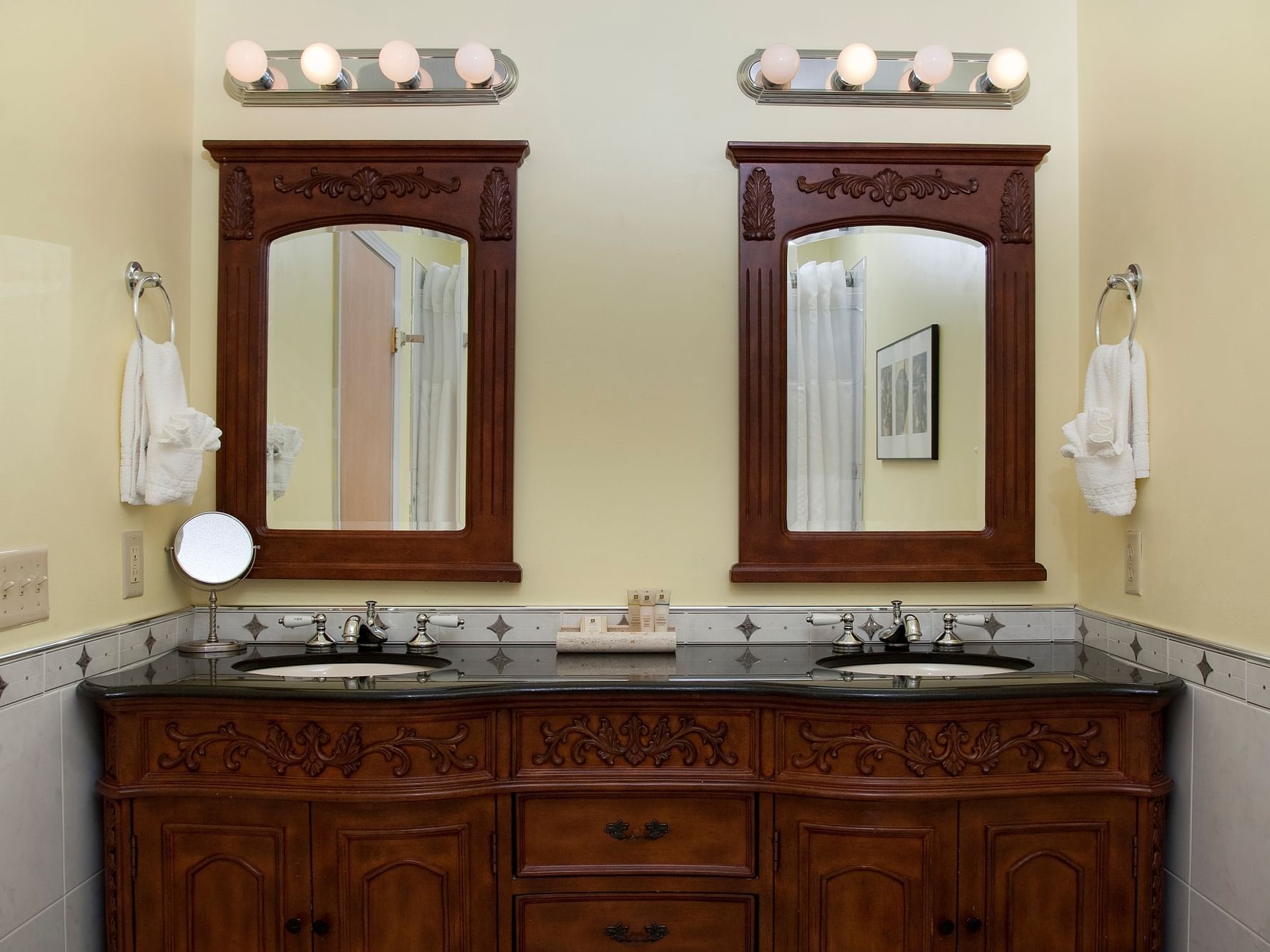 Double Sink Wooden Vanity in Deluxe Fireplace King Sunrise View at La Tourelle Hotel and Spa