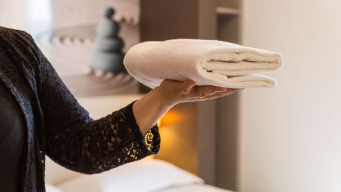 A Woman preparing a room at Clermont-Ferrand South Aubiere