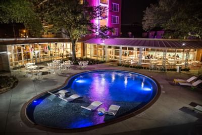 a pool outside of a hotel