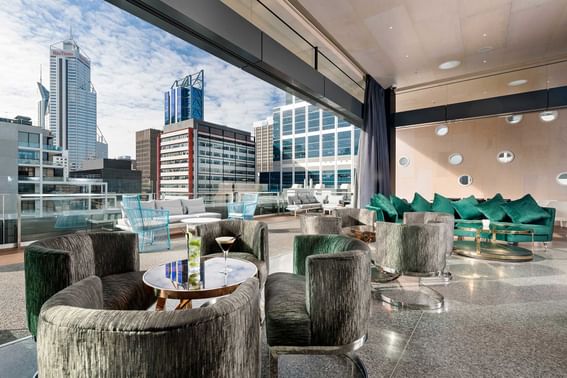 Lounge area overlooking the city in Aurora Rooftop Bar at Melbourne Hotel Perth