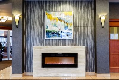 fireplace with artwork above