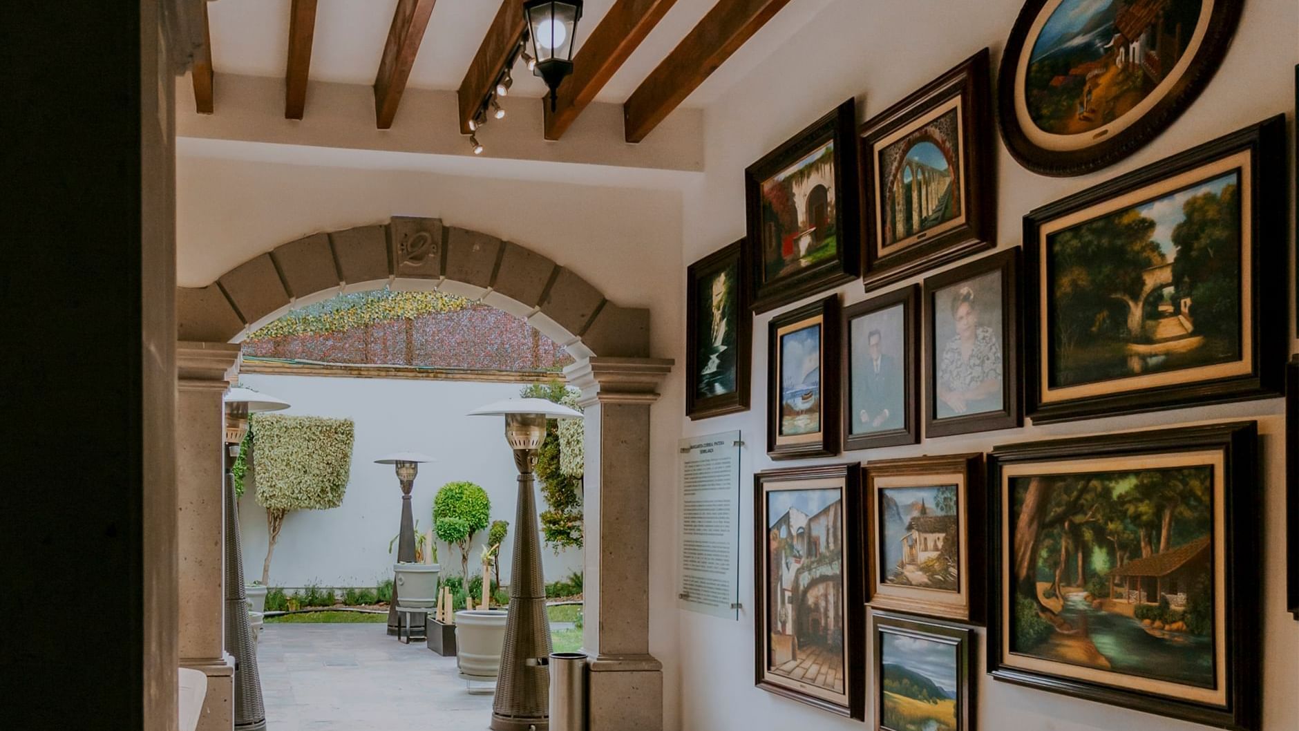 Modern gym with treadmills, workout machines and a TV at Fiesta Inn Suites Aeropuerto del Bajio