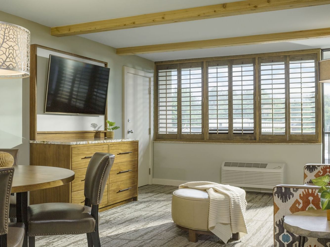 Living area with sofa & a TV in One Bedroom King Suite at High Peaks Resort