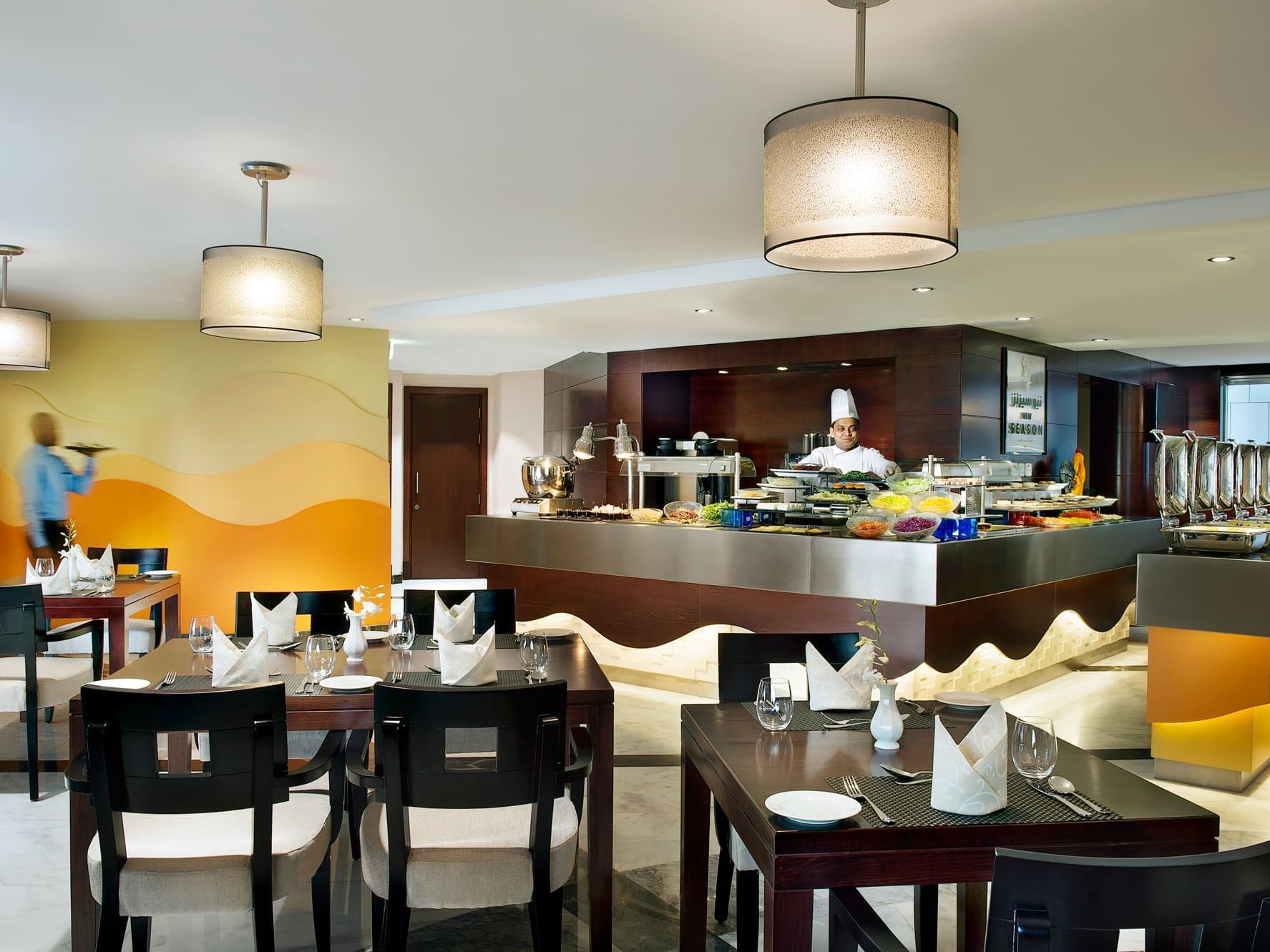 Dining area & buffet in New Season at City Seasons Hotels