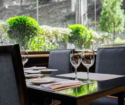Dining set up with wine glasses at Hotel Emperador Buenos Aires