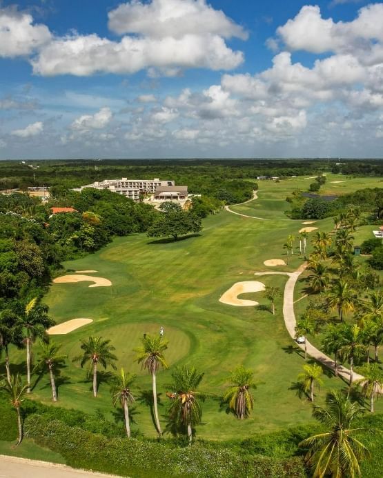 Aerial view La Estancia Golf Club surrounded by lush greenery near The Hub Acunmeyda