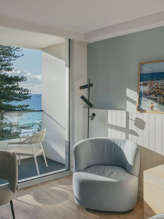 Ocean View Two Bedroom at Elysium Manly with a round table, featuring a blue chair, best places to stay in Manly