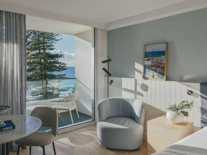 Ocean View Two Bedroom at Elysium Manly with a round table, featuring a blue chair, best places to stay in Manly
