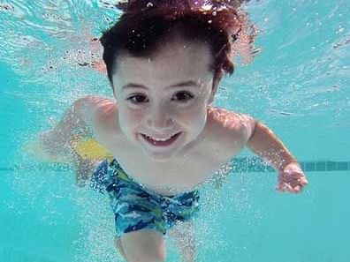 kid swimming in a pool