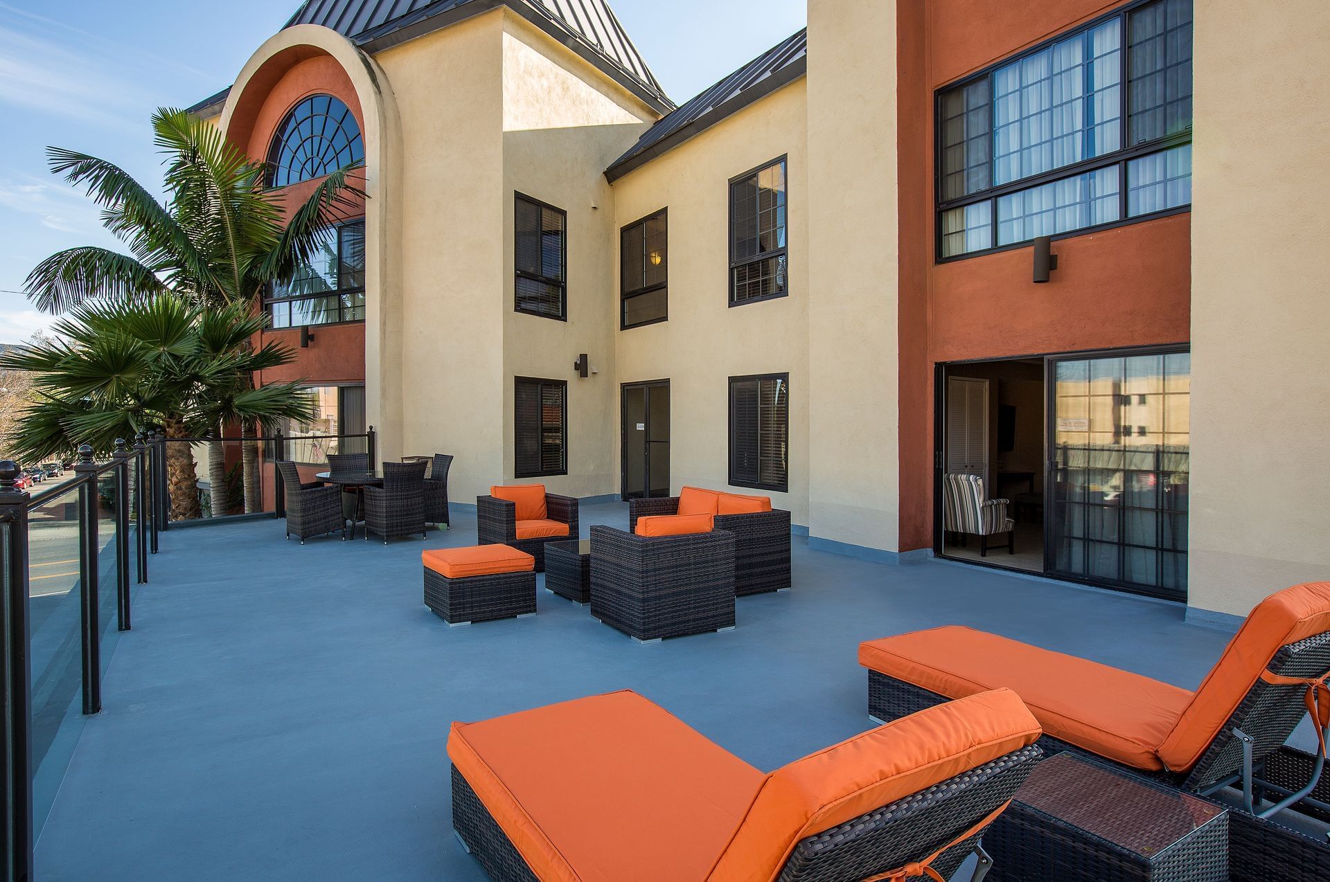 outside terrace with orange lounge chairs