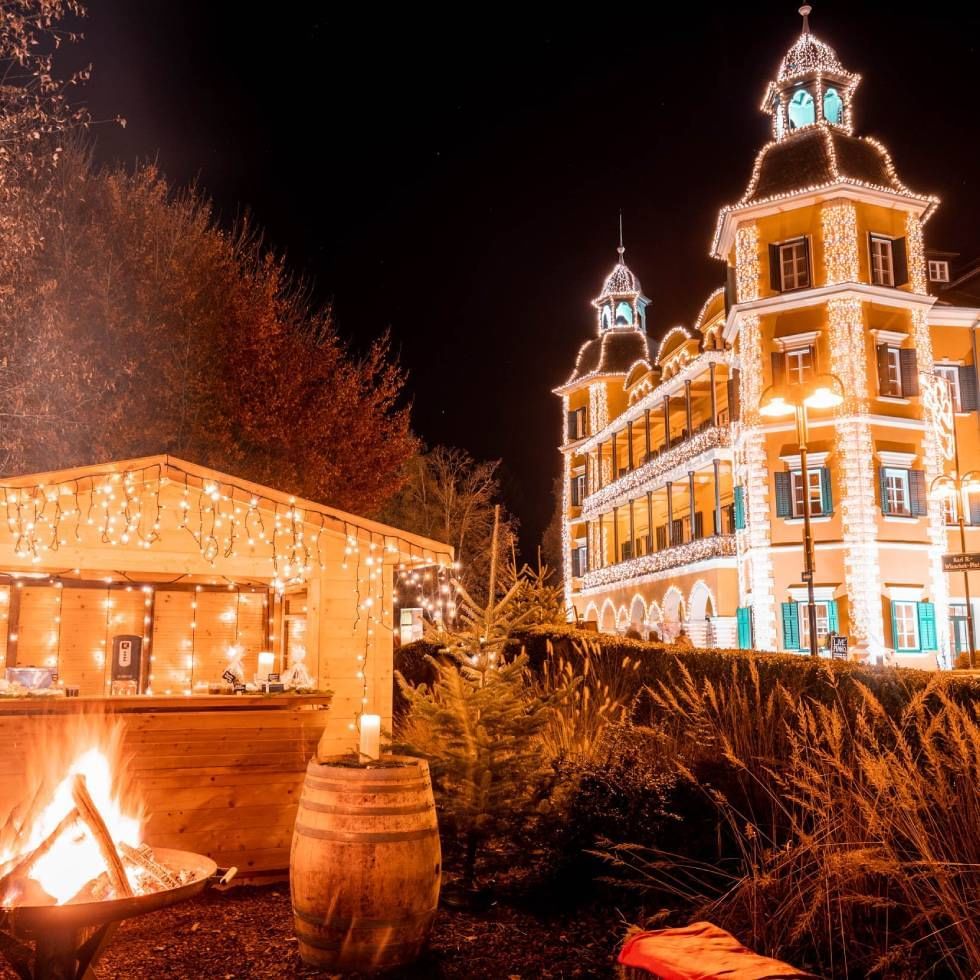 Christmas décor on buildings at night in Falkensteiner Hotels