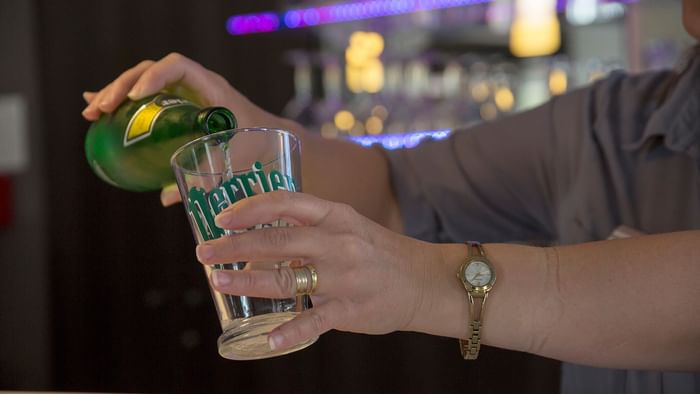 Waiter pouring beer at Hotel Novella Confort Nantes East