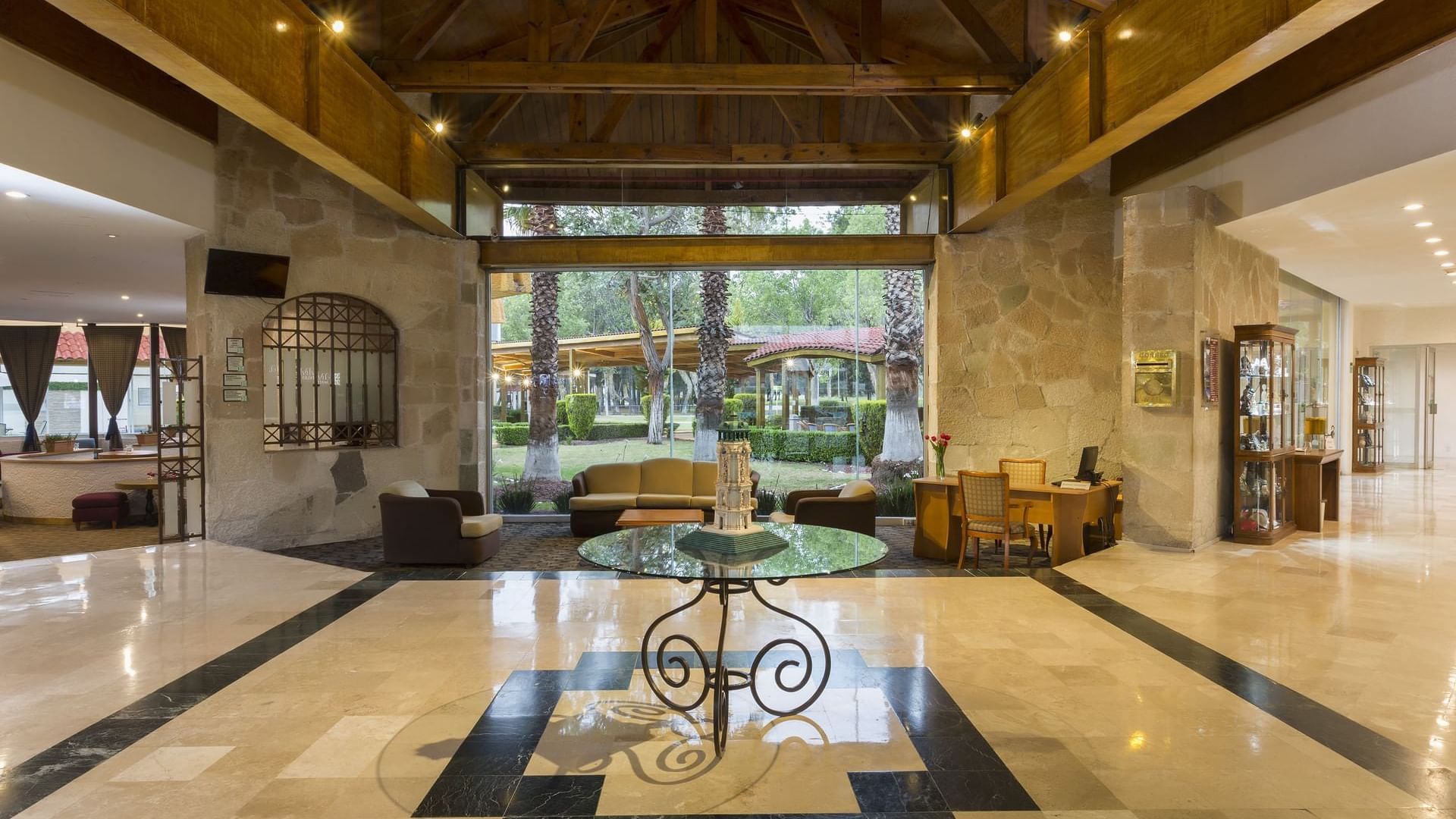 Lounge area with comfy seating's and marble floors at Gamma Pachuca