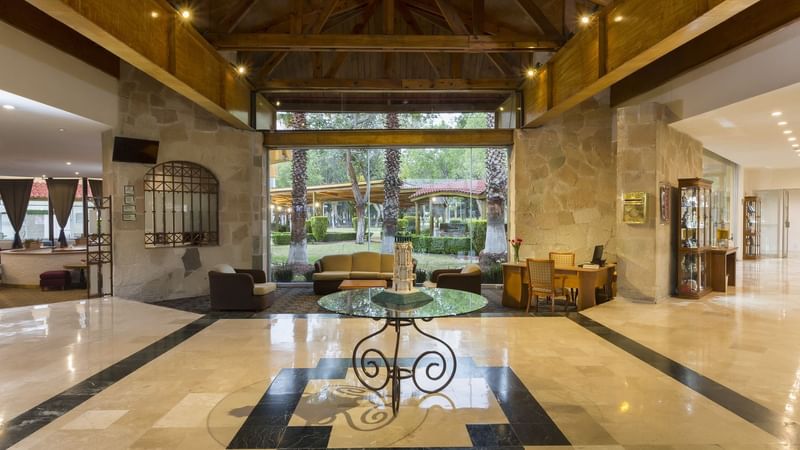 Lounge area with comfy seating's and marble floors at Gamma Pachuca