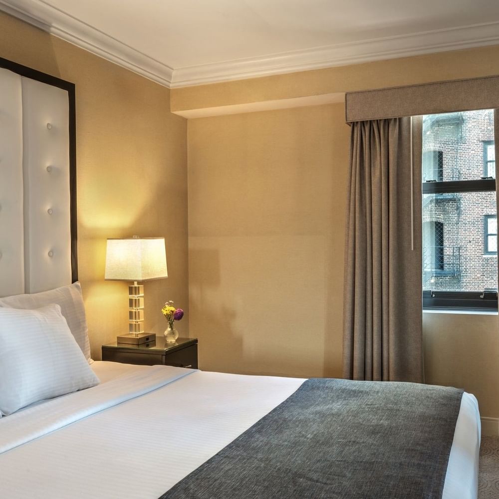 Superior Suite room with large bed, window, and TV at Warwick Allerton - Chicago in Chicago.