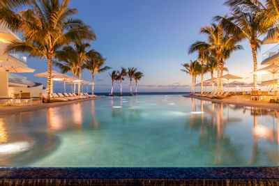 Outdoor pool area at night, The Morgan Resort Spa Village