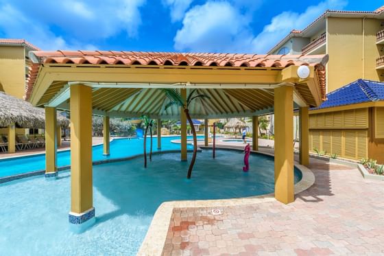 A hut in the outdoor pool at Eagle Aruba Resort