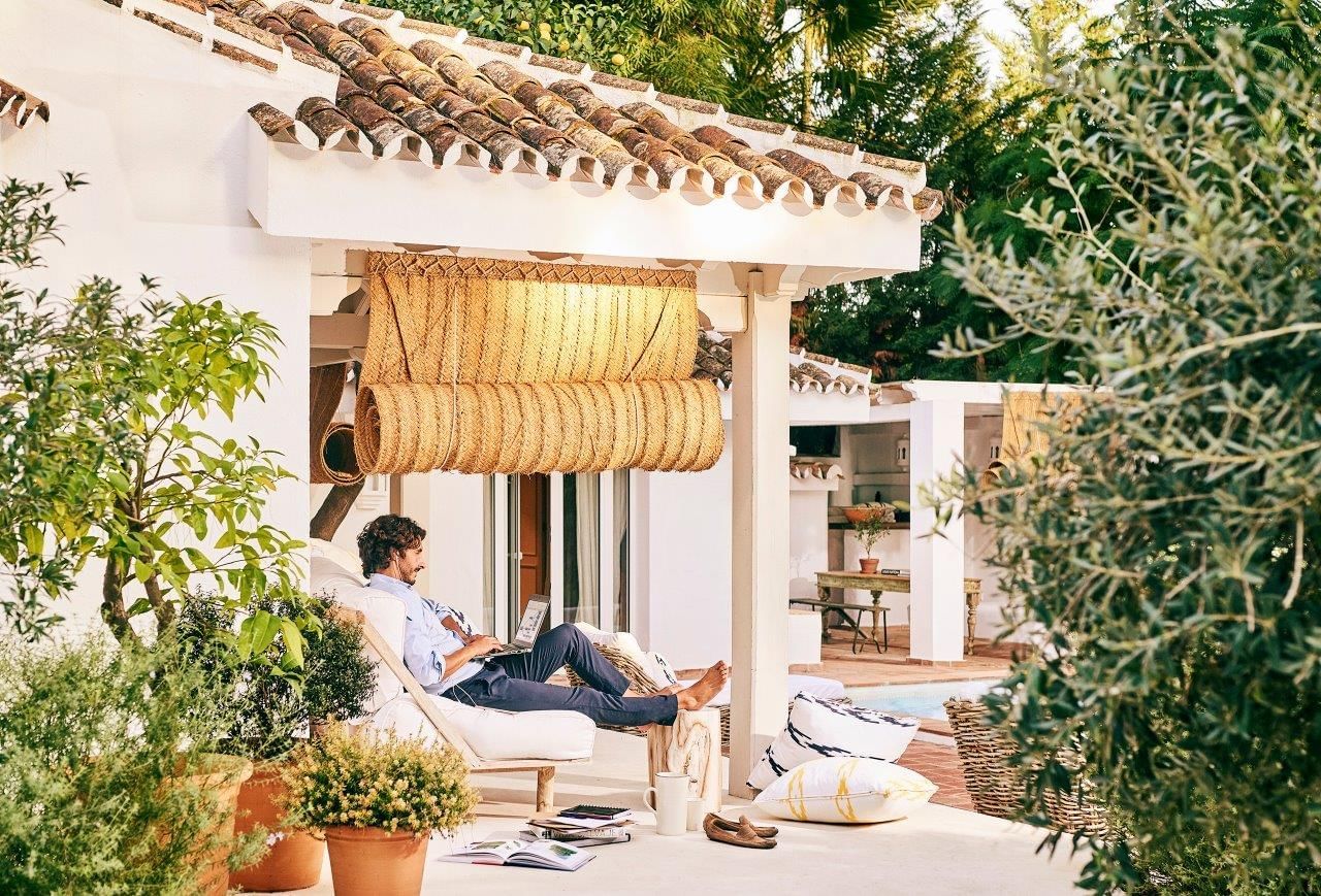 Man working by the pool at Marbella Club Hotel