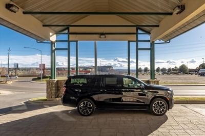 A vehicle with hotel sign parked in the motor lobby at Boothill Inn & Suites