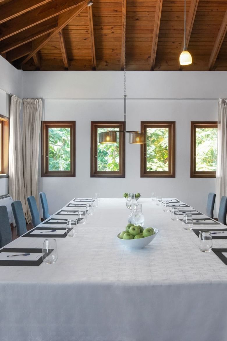 A meeting table with notepads & water glasses at Club Hemingway