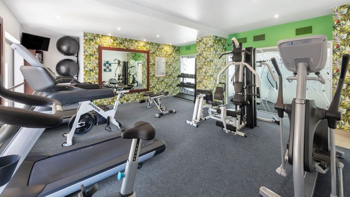 Gymnasium with cardio exercise machine at James Cook Hotel Grand Chancellor