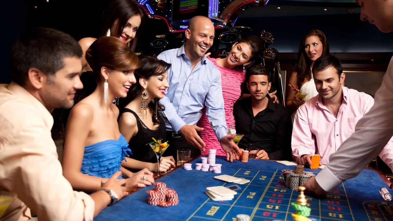 Group of friends playing table games at a casino