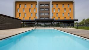 Exterior view of The Originals Hotels with swimming pool