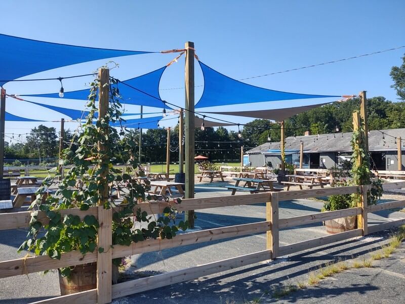 Outdoor dining area with benches at Inn at Willow grove