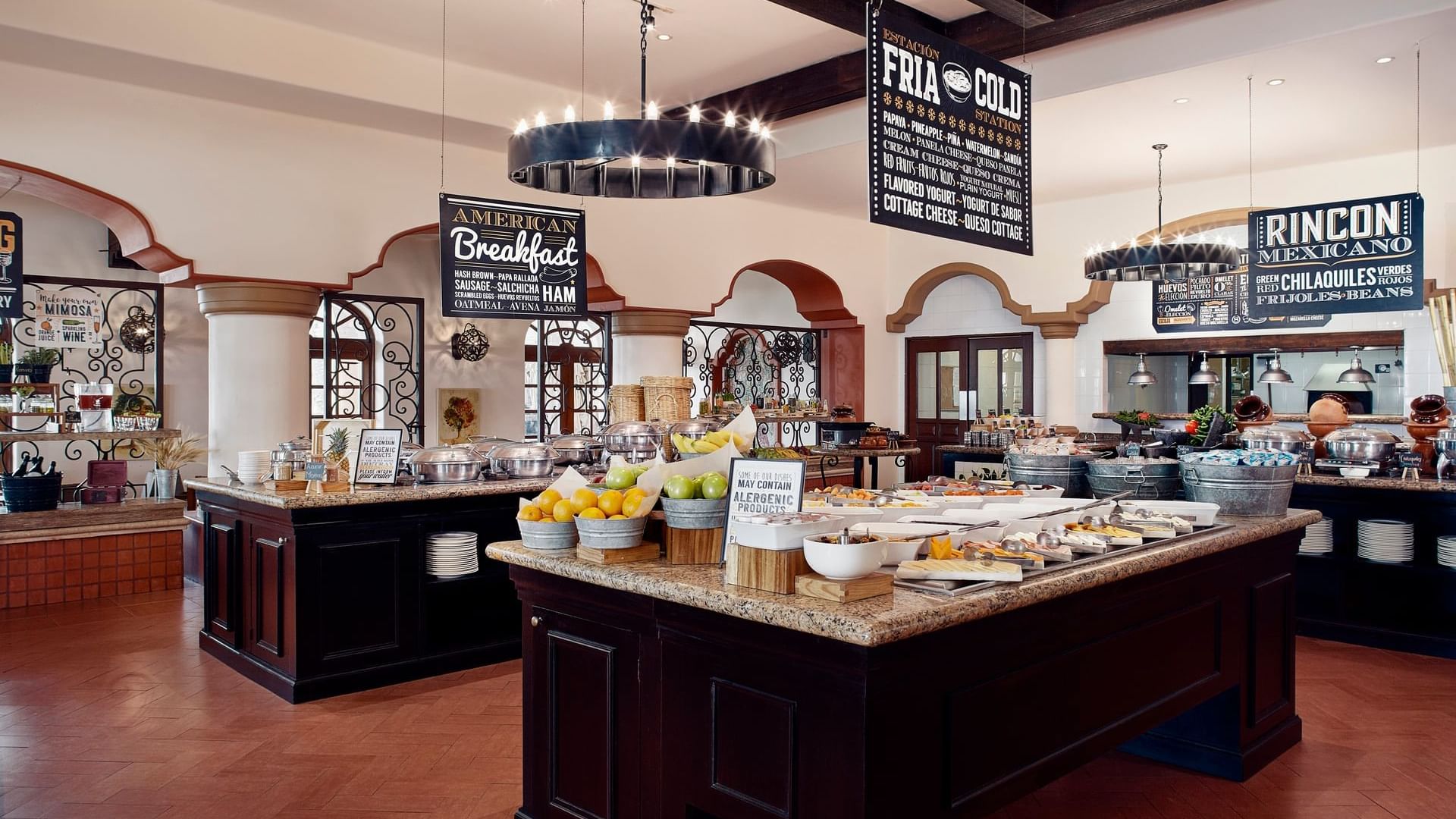 Buffet station with various hot and cold breakfast foods at Tomates Restaurant in Hacienda del Mar Los Cabos.