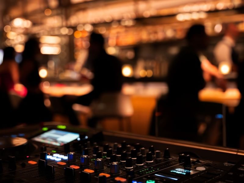 DJ equipment with people in The May Fair Bar