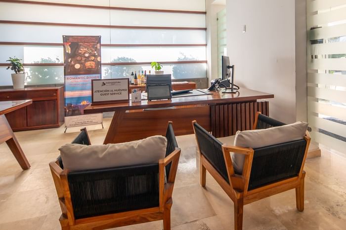 Guest service desk with comfy chairs at Buenaventura Grand Hotel and Spa