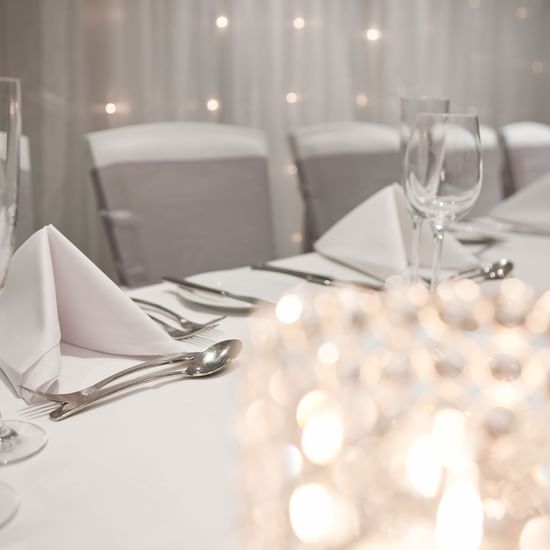 Close-up of arranged banquet table with candle in a Ballroom at Pullman Sydney Hyde Park