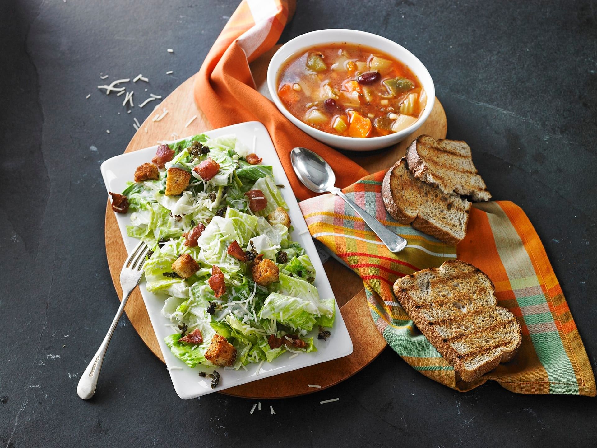 A fine meal with roasted bread & salad served at Clique Hotels