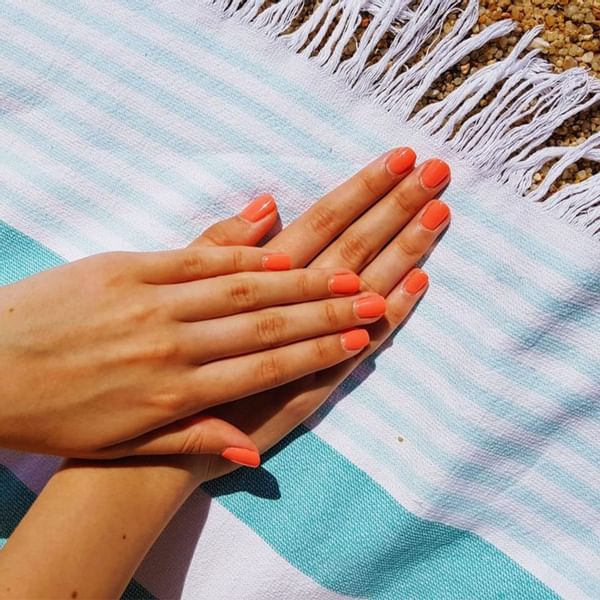 Close-up of hands with nail polish at Falkensteiner Hotels & Residences