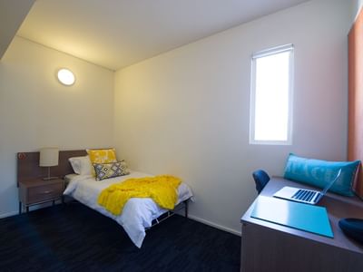 Student Living East West_Adelaide bedroom featuring study desk, chair, single bed & wardrobe