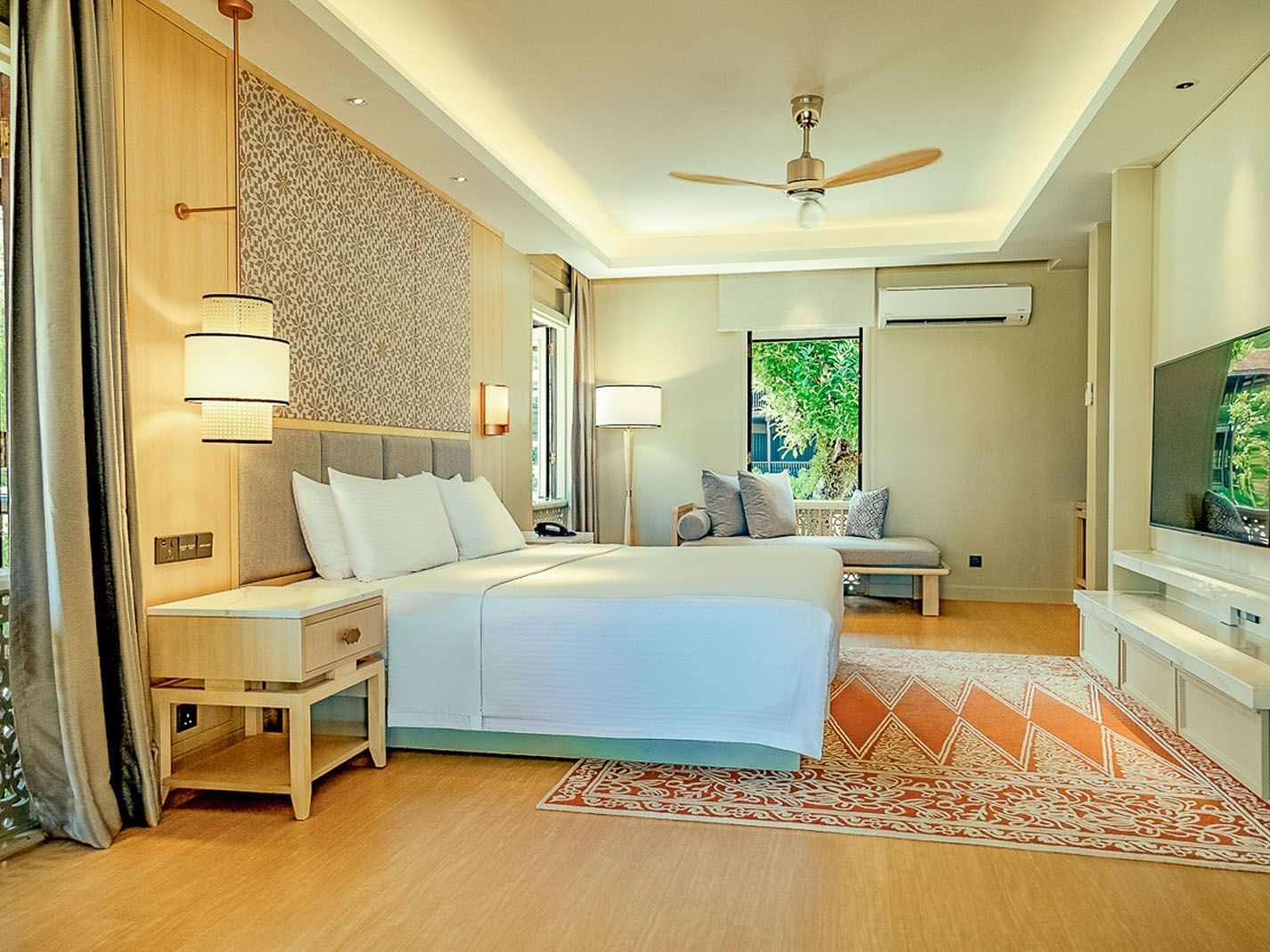 King bed in Pelangi Junior Suite at Pelangi Beach Resort & Spa