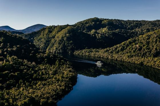 Landscape view of the mountains & river at Gordon River Cruise