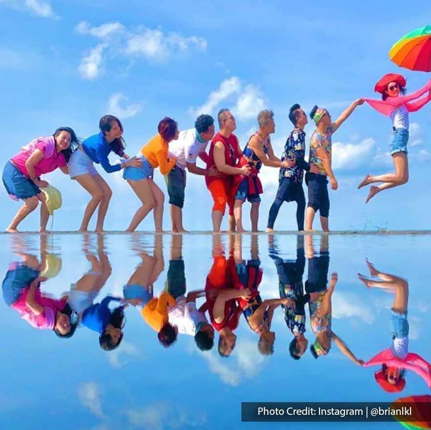 A group of people were taking a picture at Bagan Datuk Sky Mirror - Lexis Suites Penang