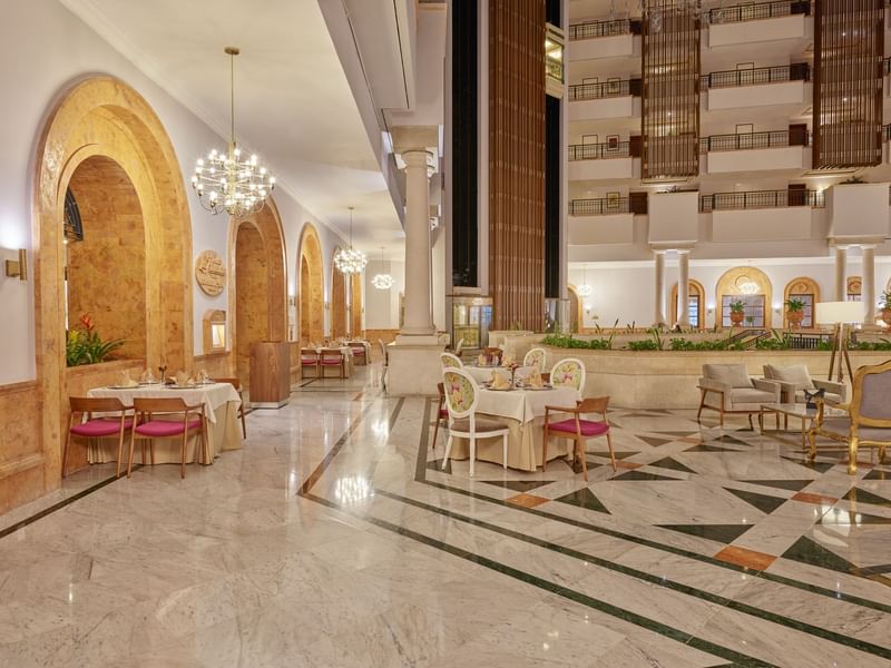 Hotel lobby dining & lounge area at La Colección Resorts