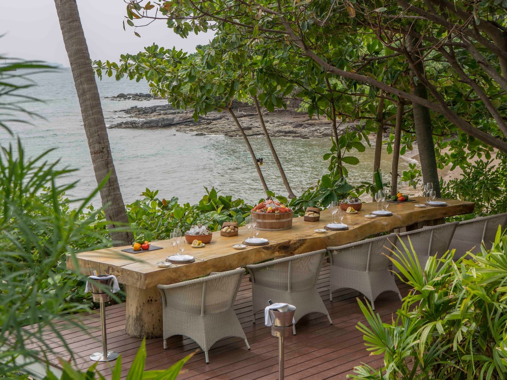Dining Table setup near the beach at Amatara Wellness Resort