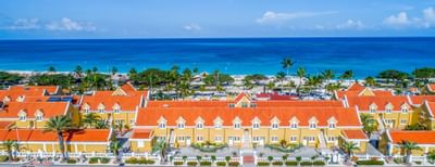 Distant aerial view of the beach, city & Amsterdam Manor Resort