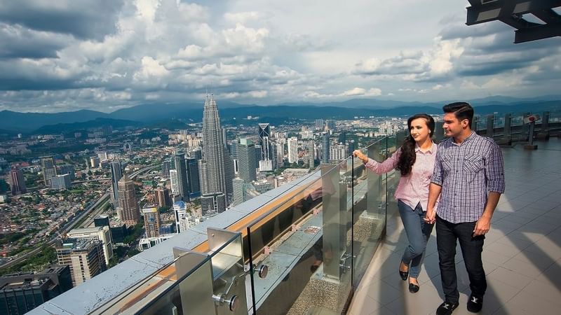 Couple site-seeing from the LK tower near Sunway Hotel Pyramid