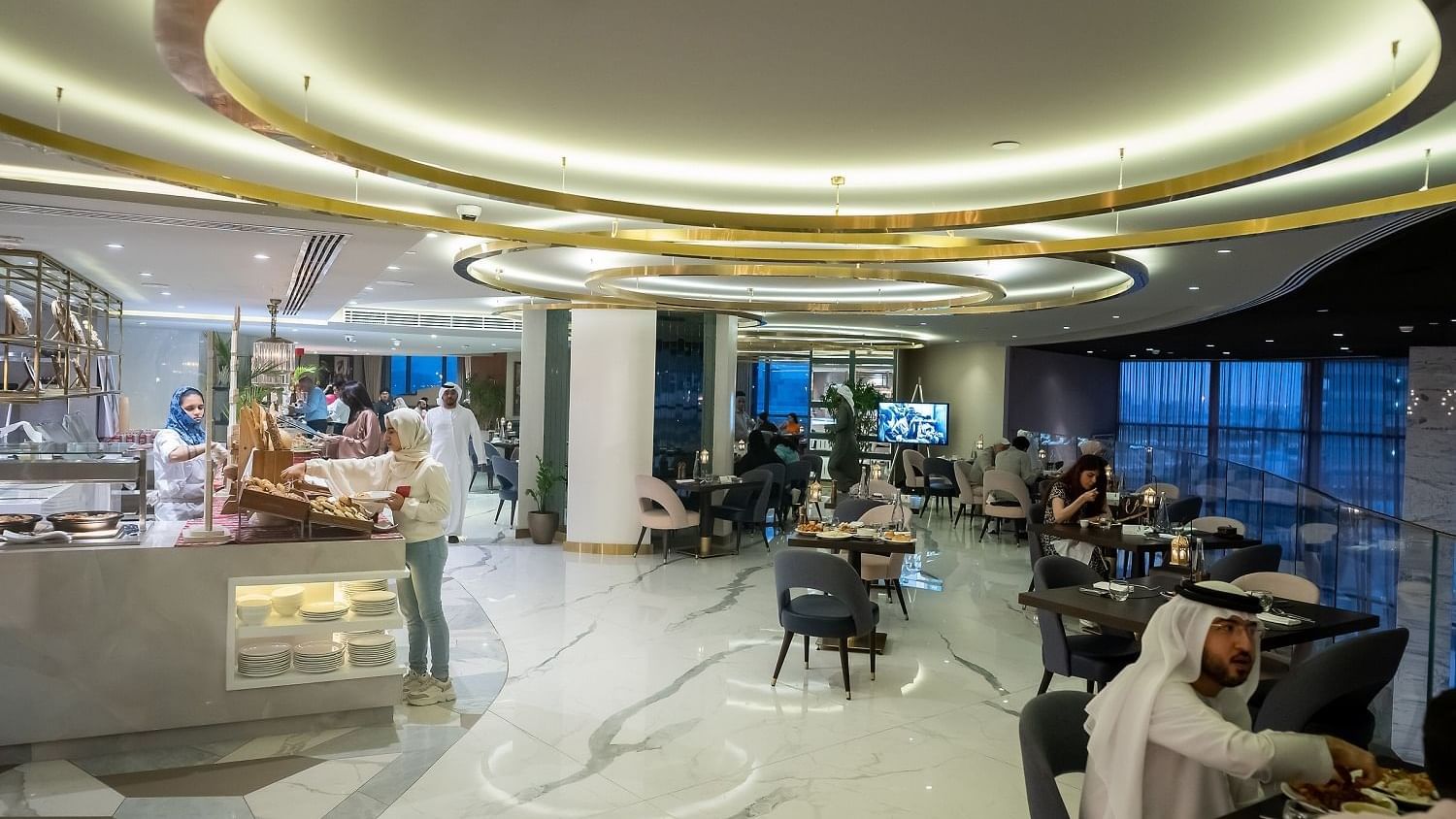 People dining food in The Stage Restaurant at Paramount Hotel Dubai