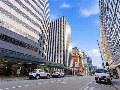 Modern urban street view with buildings and cars at UniLodge Stafford House.