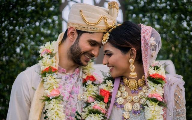 Hindu wedddings at Easthampstead Park featuring newly wedded couple looking at each other