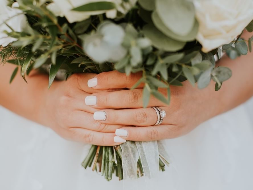 Close-up of bride's hands, holding a bouquet featuring 2025 Wedding Special Offer at The Milner York, York hotel deals