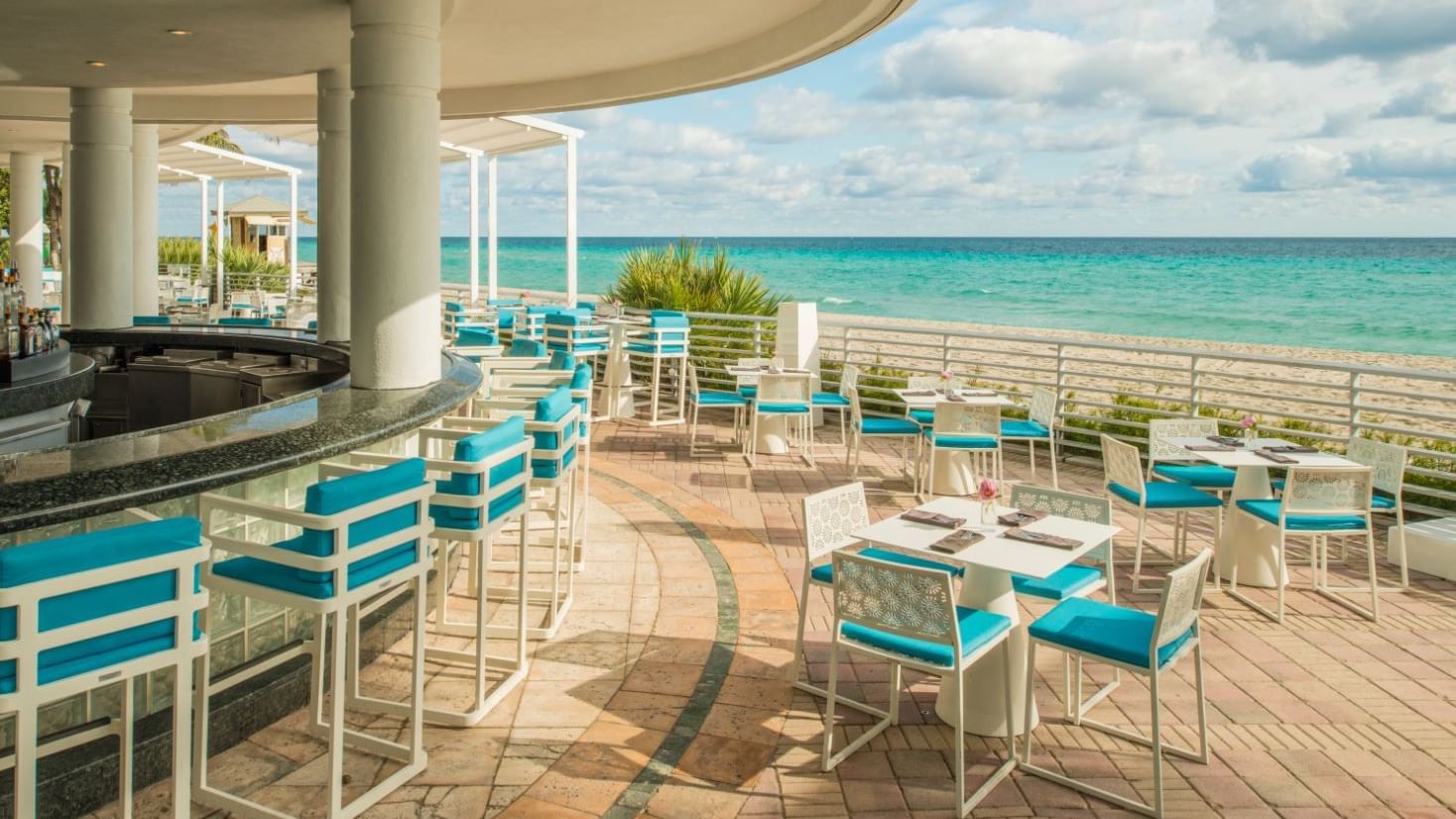 Dining area with sea view in Playa Beachfront Bar & Grill at The Diplomat Resort