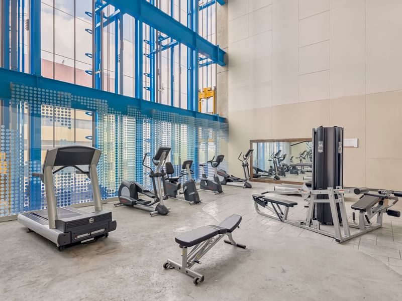 Gym and wellness area with equipment at Fiesta Inn